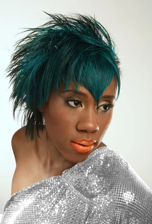 Choppy teal crop with a long side fringe, worn with a silver sequinned wrap