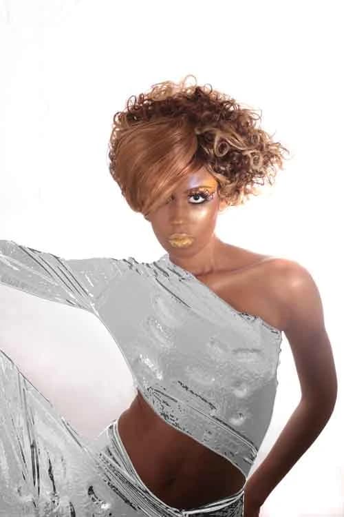 Asymmetric copper curls, worn with a draped silver top