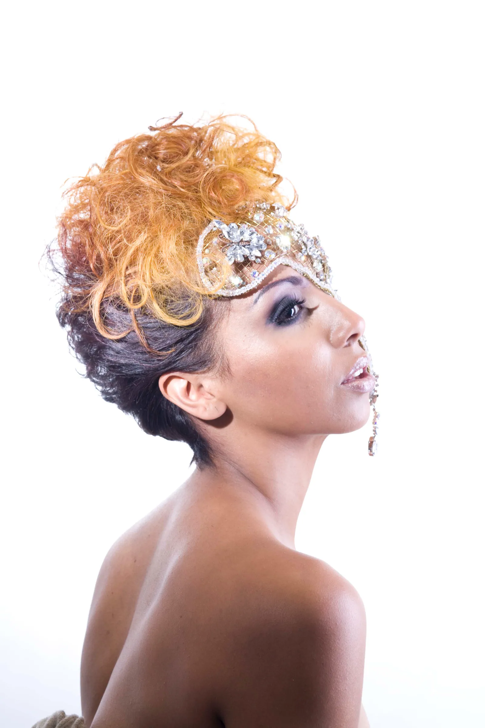 Blonde curls swept up over a darker base and dressed with a jewelled headpiece, from Applekosit's award-winning 2009 colour collection