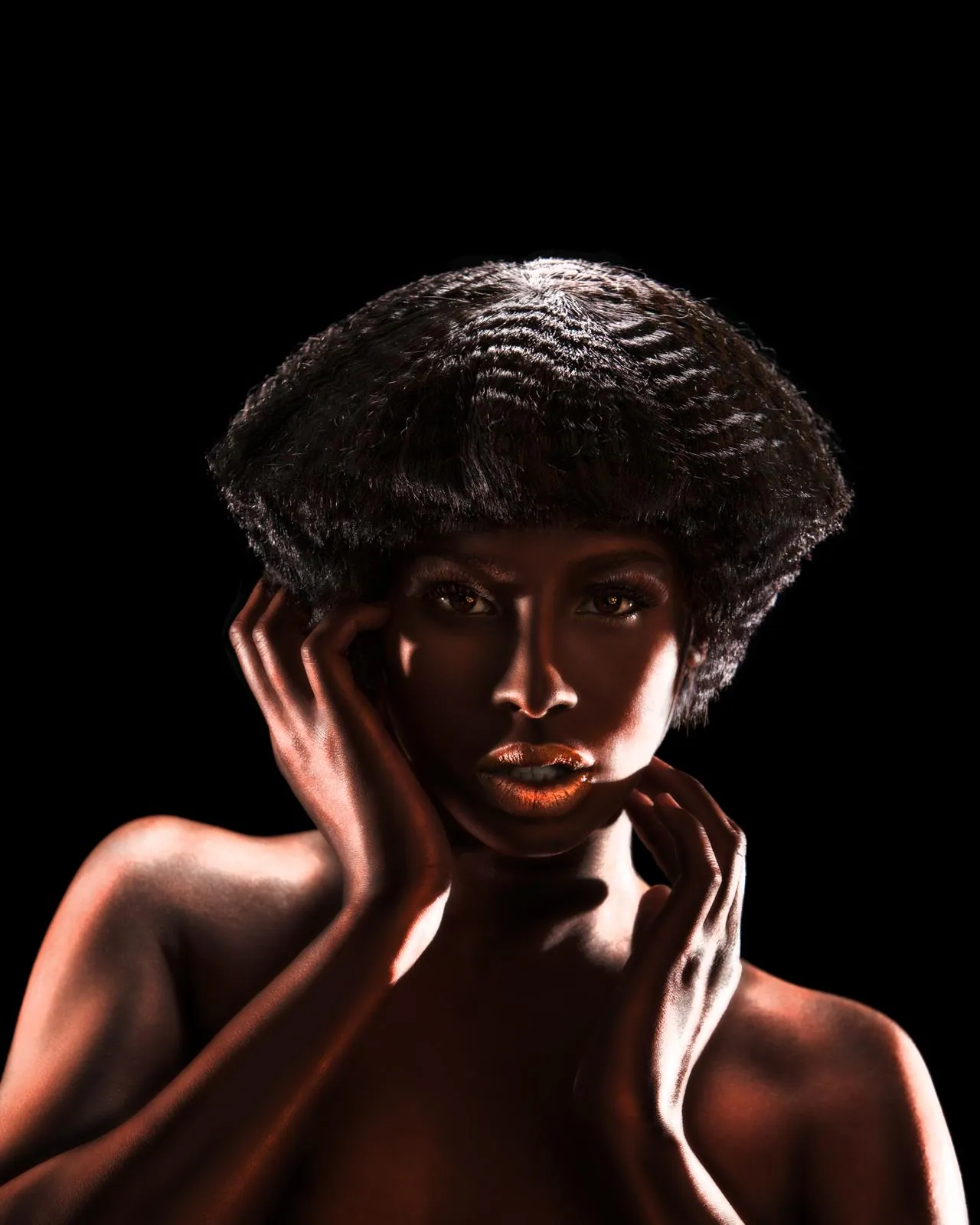 Close view of a rounded, sculpted shape with a waved texture